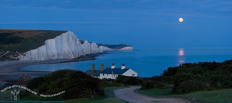 slides/Full Moon rising.jpg coast guard cottages east sussex coastal coast blue sky winter seaside snow cold bitter panoramic cliffs white lighthouse seven sisters country park cuckmere haven river beach moon rise reflection Full Moon rising